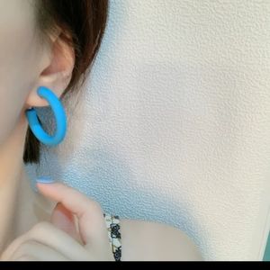Bright blue hoop earrings